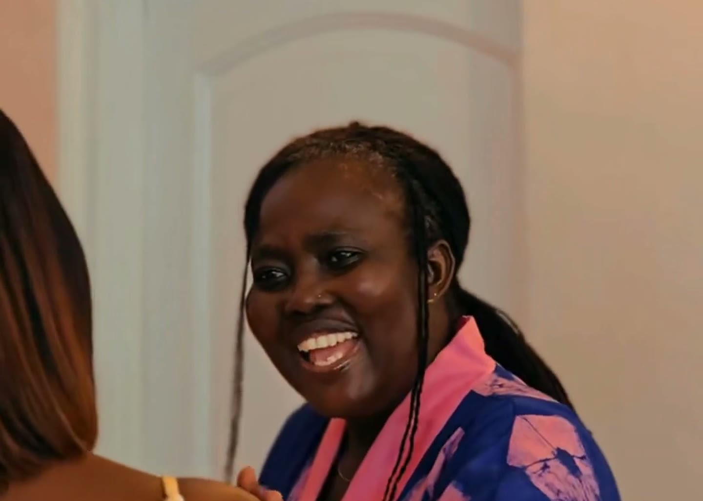 A 10/11 Kenkey owner smiling at the counter: she stopped guessing and built a system with Datana